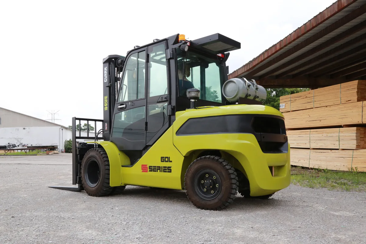 Pneumatic-tire forklift working an outdoor yard