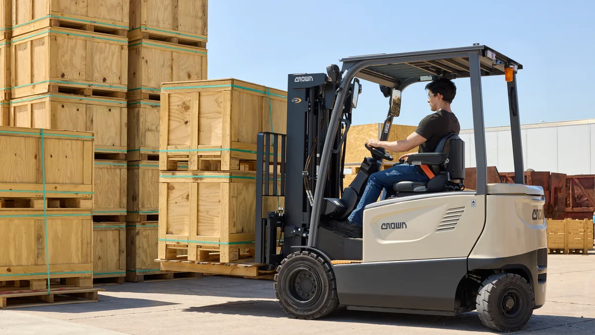 Forklift operator at the controls during on-site training and evaluation